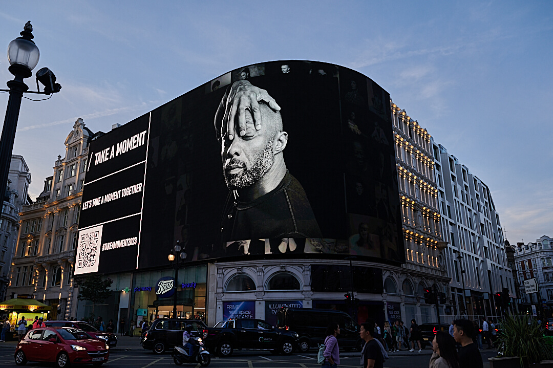 Take A Moment being screened on Piccadilly Lights